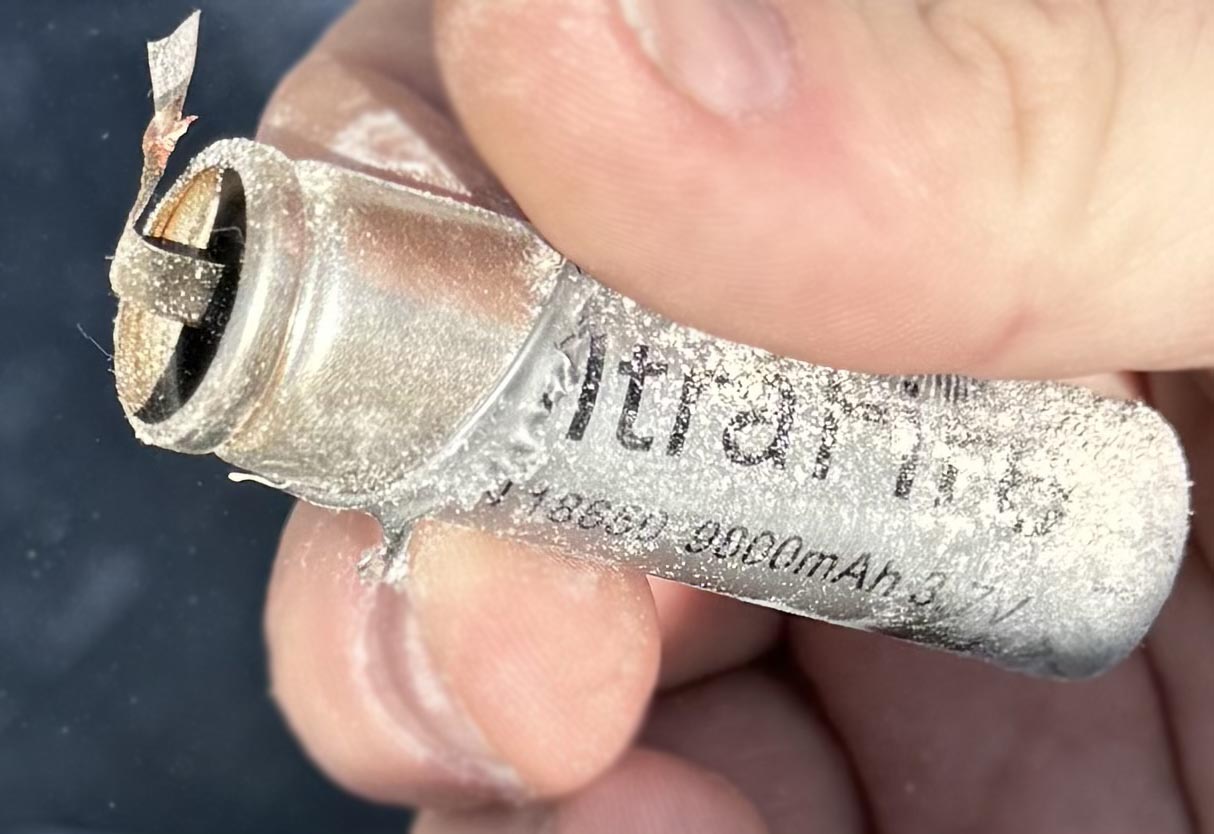 Photograph of a 18650 lithium-ion battery case which is no longer intact